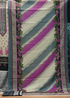 Traditional fabric with floral patterns and geometric designs on a wooden background