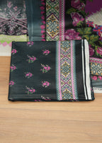Colorful fabric with intricate patterns on a wooden surface