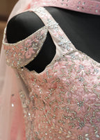 Close-up of a pink embroidered garment with a blurred background