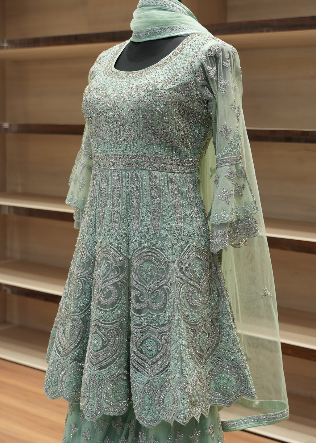 Green gardening glove on a wooden stand