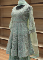 Green gardening glove on a wooden stand