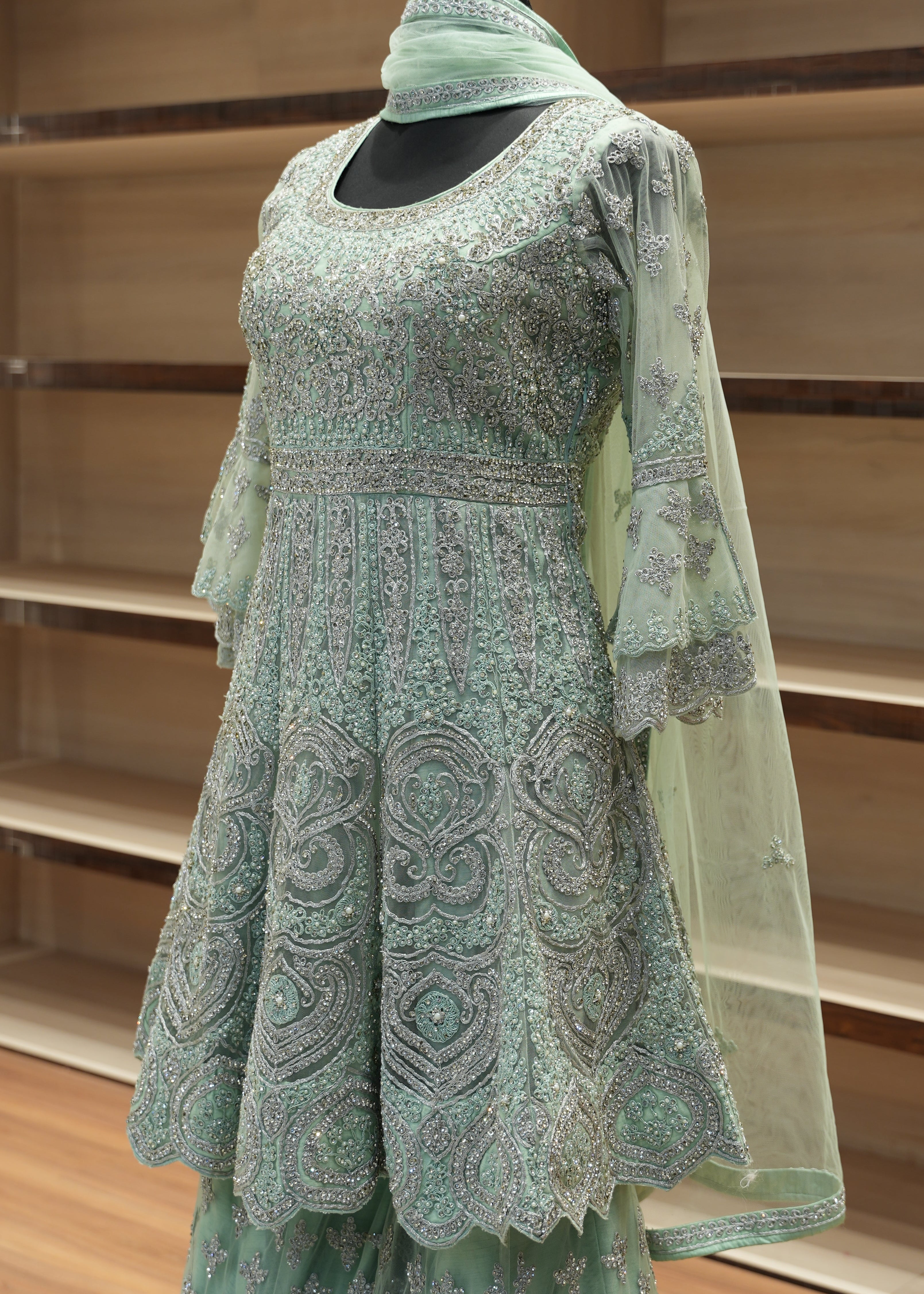 Green gardening glove on a wooden stand