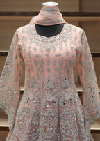 Pink embroidered traditional outfit with a matching dupatta on a mannequin against a neutral background.