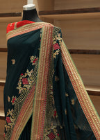 Decorative fabric with intricate patterns on a stand against a neutral background