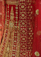 Red embroidered fabric with gold patterns
