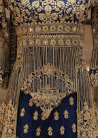 Decorative traditional outfit with intricate gold embroidery on a blue background