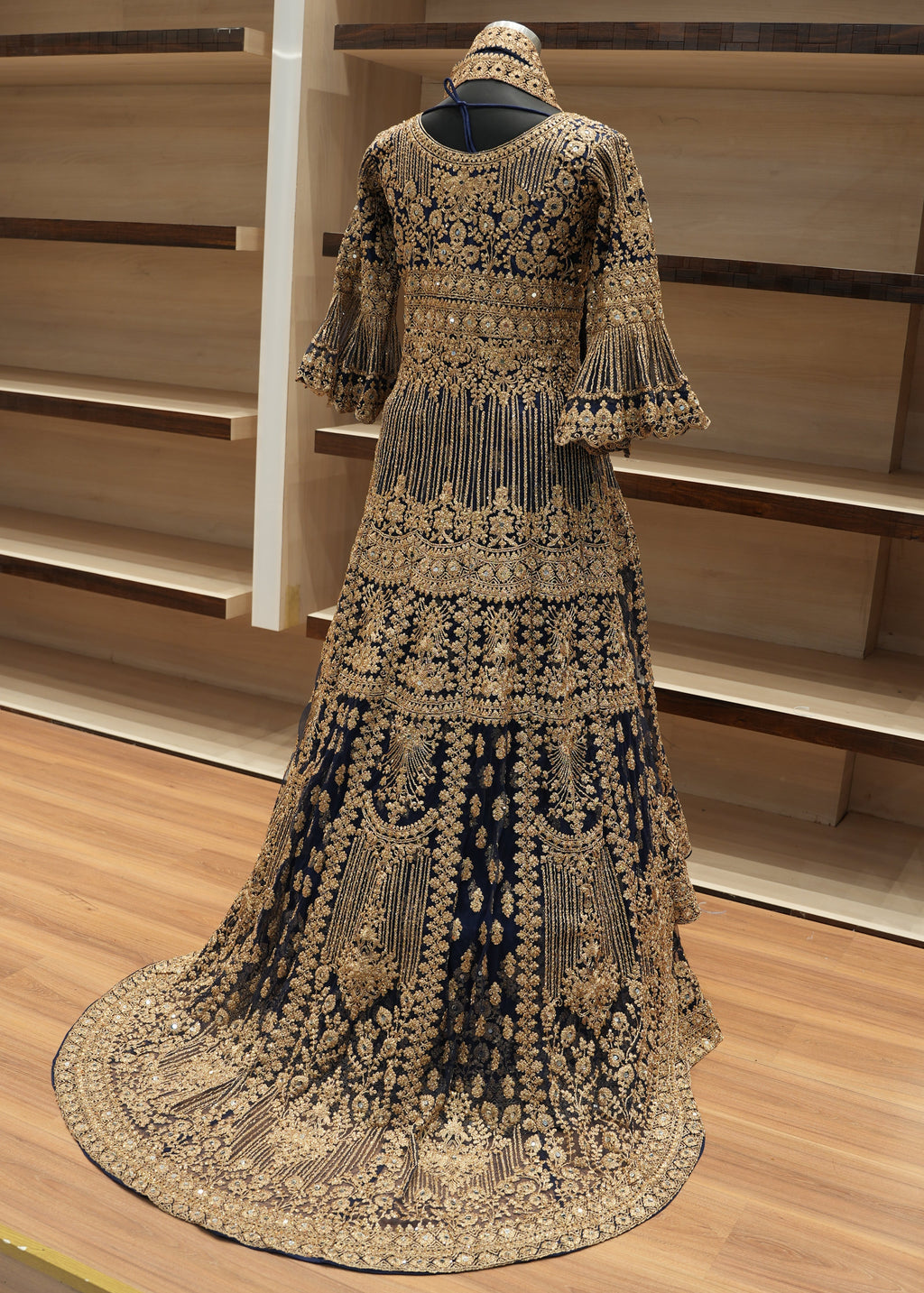 Decorative headpiece with intricate patterns on a wooden surface