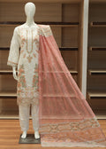Mannequin wearing a traditional outfit with a pink dupatta in a store setting