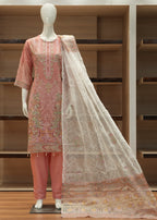 Decorative pink and beige scarf draped over a wooden shelf with a mirror.