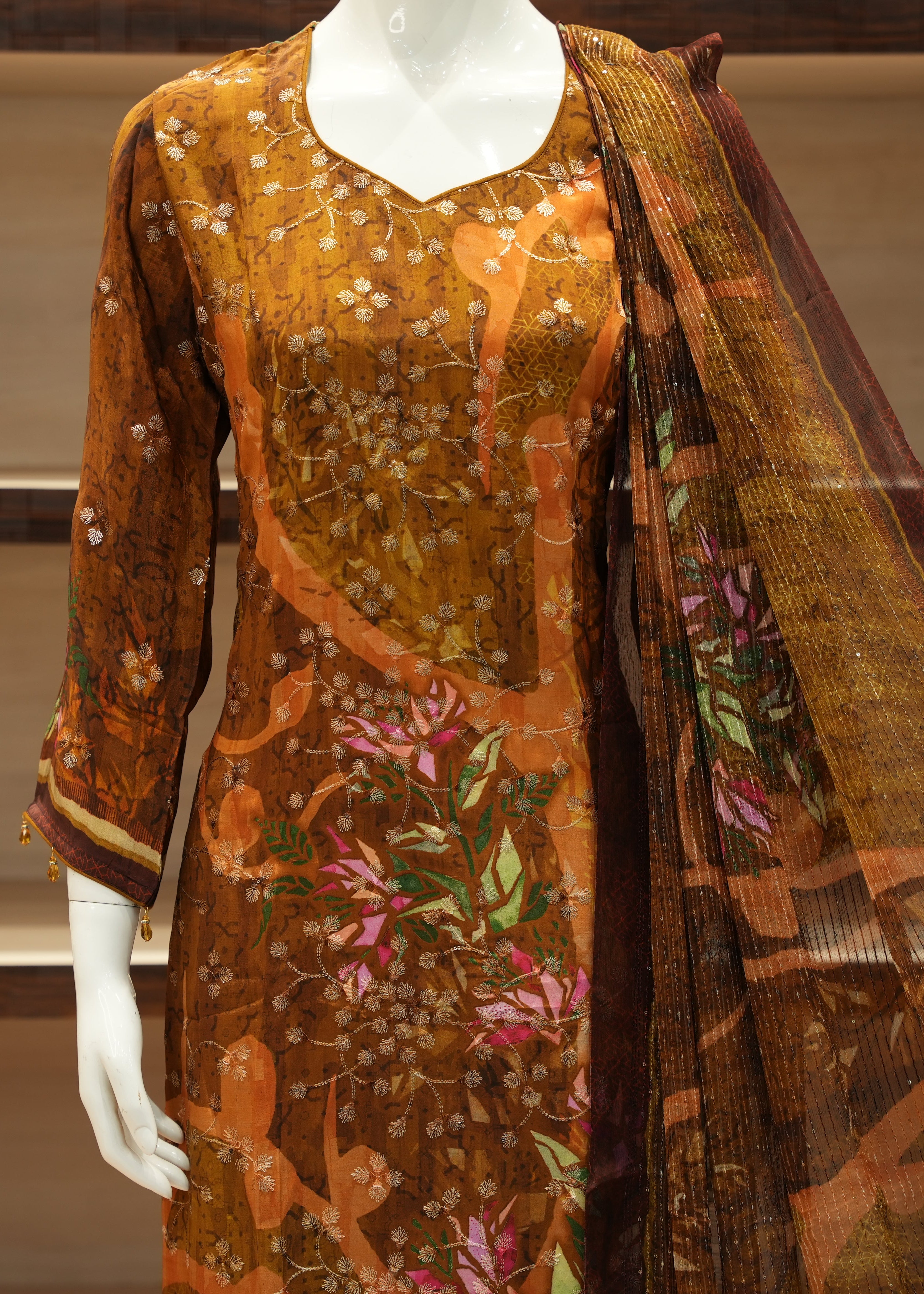 Brown floral dress with matching dupatta on a mannequin against a neutral background