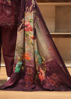 Traditional outfit with a floral-patterned fabric draped over a person, set against a neutral background.