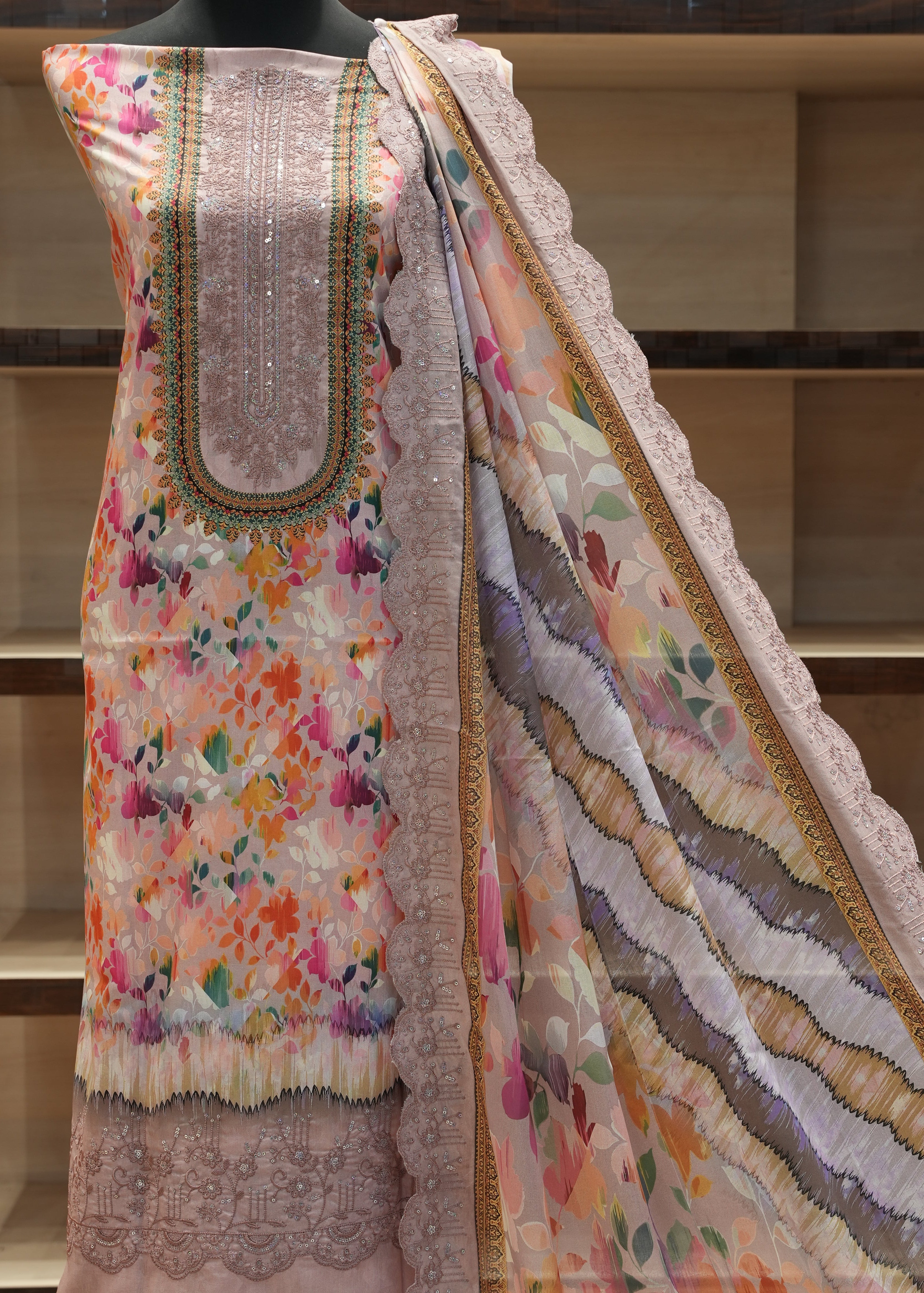 Decorative quilt with floral patterns on a wooden shelf