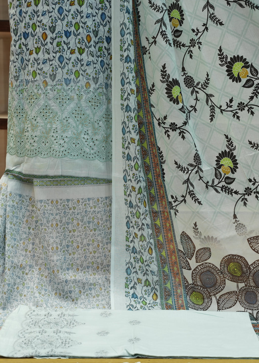 Fabric with floral patterns on a wooden surface