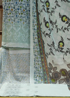 Fabric with floral patterns on a wooden surface