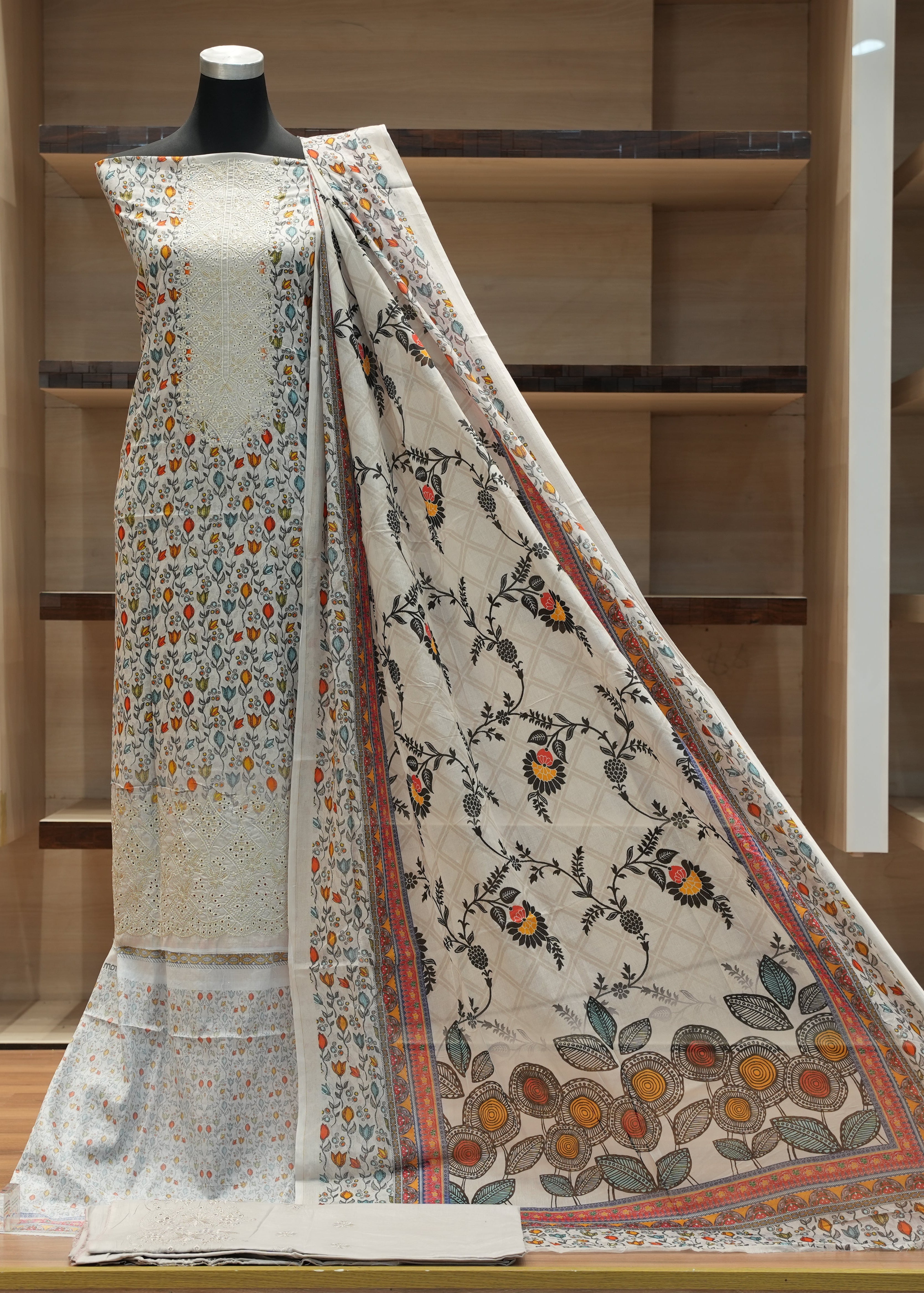 Traditional outfit with floral patterns on a wooden shelf background