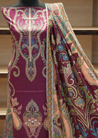 Colorful patterned fabric draped over a mannequin against a neutral background
