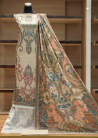 Mannequin wearing a patterned fabric with a wooden shelf background