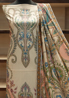Patterned fabric draped over a mannequin with a blurred indoor background