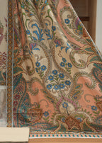 Close-up of patterned fabric with intricate designs on a wooden surface.
