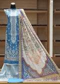 Traditional embroidered fabric on a mannequin with a wooden shelf background