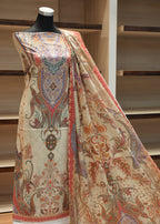 Mannequin wearing a patterned fabric with a wooden background