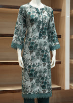 Floral dress on a mannequin against a wooden shelf background