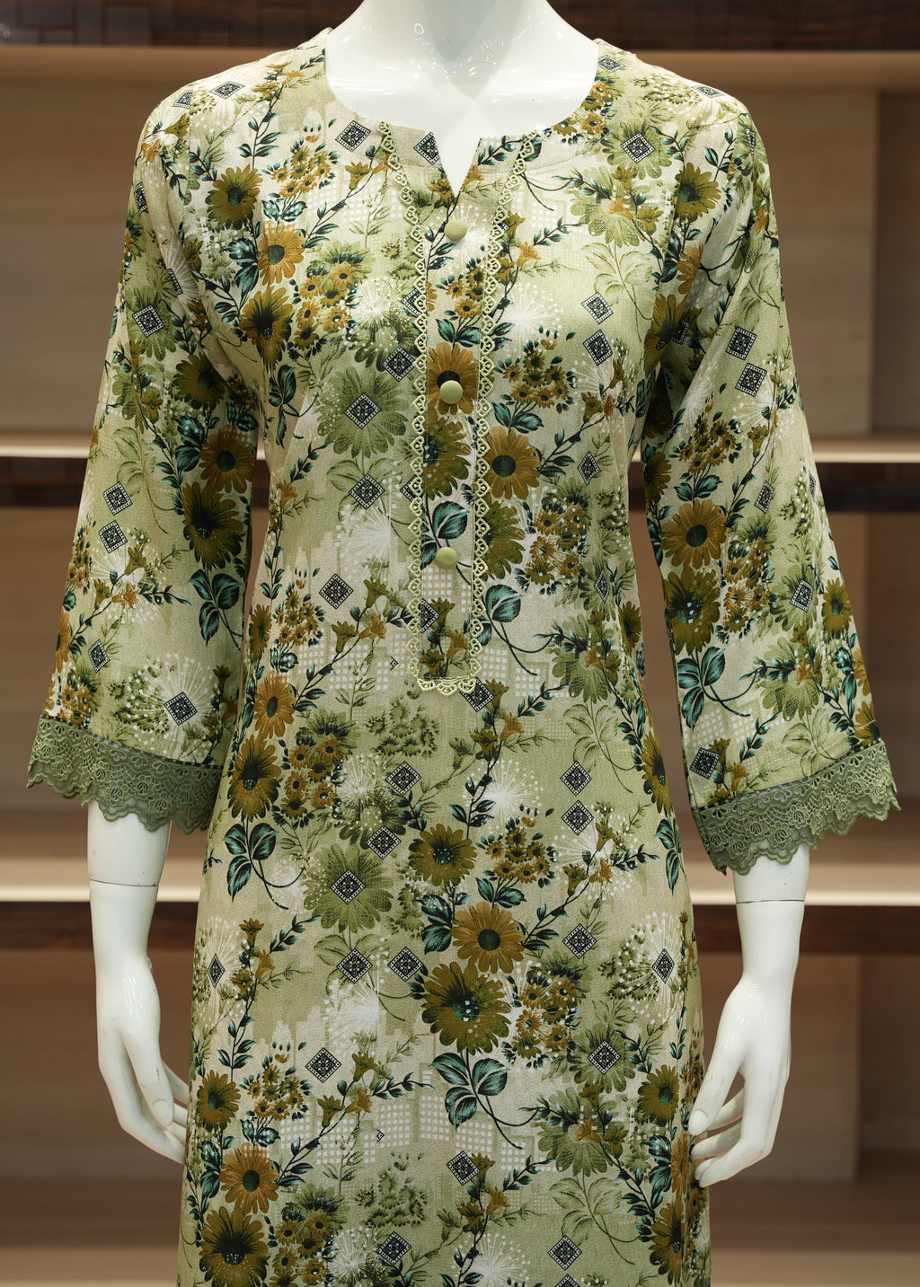 Floral dress on a mannequin against a wooden shelf background
