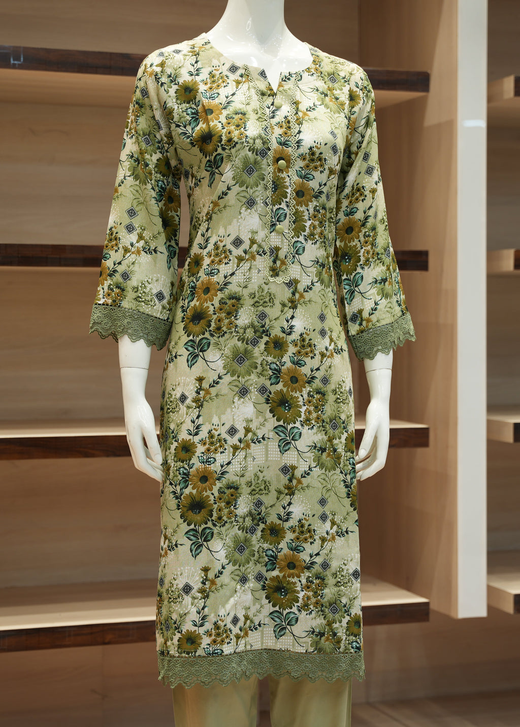 Floral dress on a mannequin against a wooden background