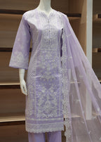 Lavender embroidered outfit with a dupatta on a mannequin against a wooden background