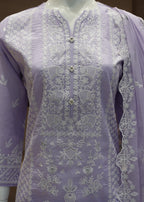 Lavender embroidered outfit on a mannequin with a blurred background