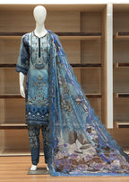 Mannequin wearing a blue embroidered outfit with a matching shawl in a wooden cabinet setting