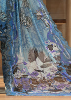 Blue and patterned fabric with a person wearing a matching outfit in a room.