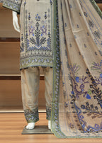 Traditional outfit with embroidered top, pants, and dupatta on a wooden stand.