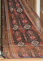 Decorative rug with intricate patterns on a wooden floor.