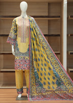 Mannequin wearing a traditional outfit with a yellow dress, multicolored dupatta, and embroidered top against a wooden background.