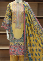 Colorful embroidered traditional outfit with a yellow base on a wooden shelf background