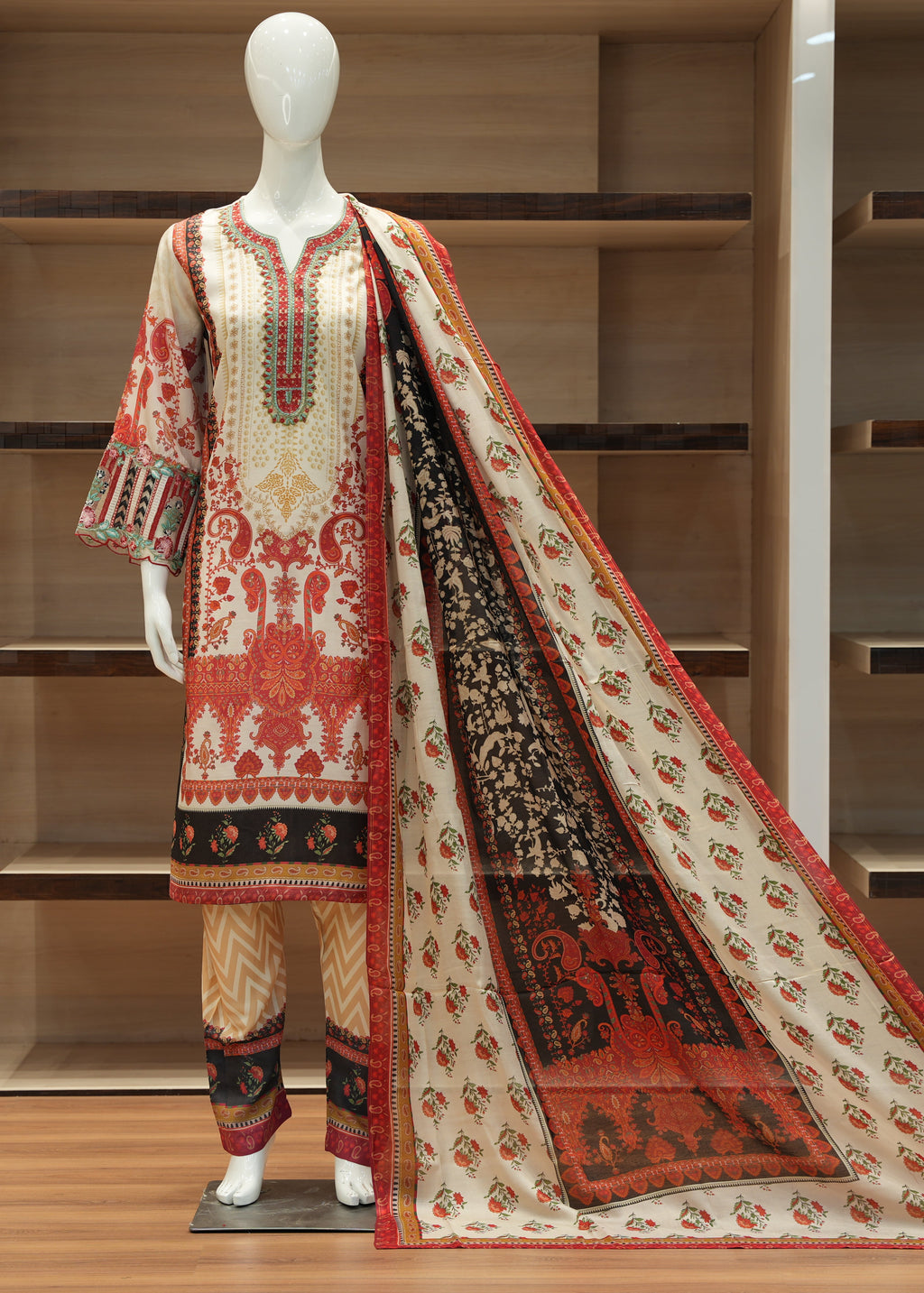 Traditional embroidered outfit on a mannequin against a wooden background