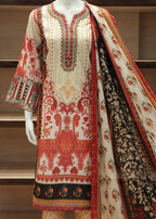 Traditional embroidered outfit with a dupatta on a mannequin against a wooden shelf background