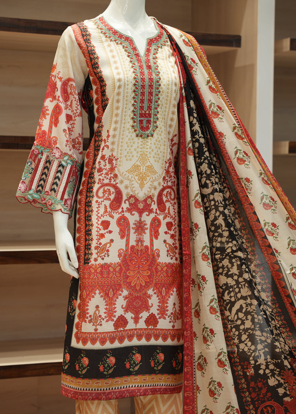 Traditional embroidered outfit on a mannequin with a wooden background