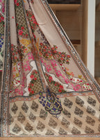Colorful traditional outfit with floral and paisley patterns on a wooden floor.