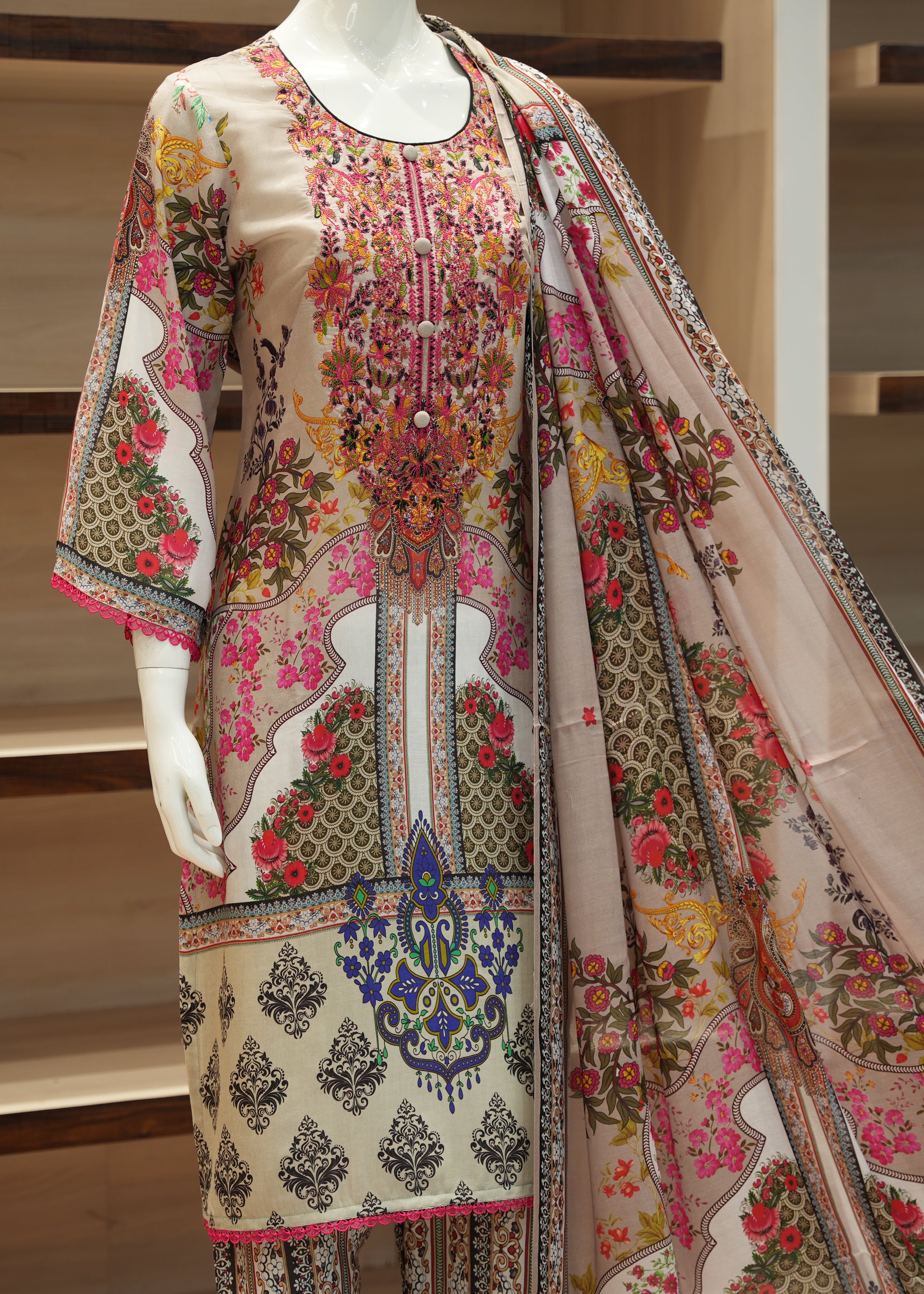 Embroidered traditional outfit on a mannequin with a wooden background