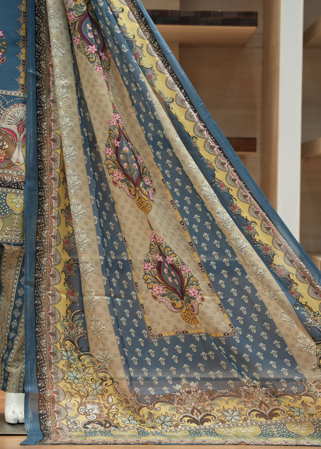 Decorative rug with intricate patterns on a wooden floor