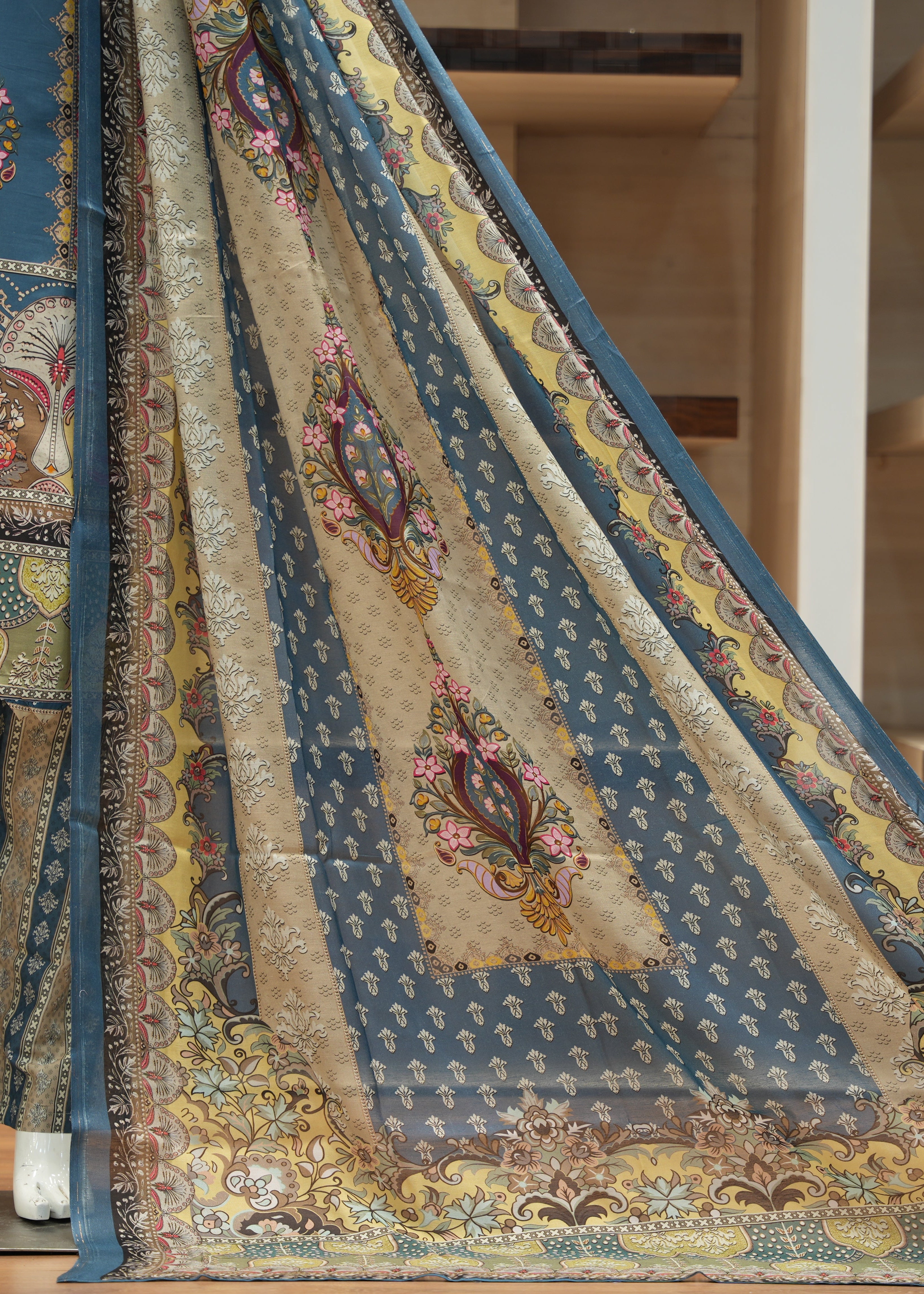 Decorative rug with intricate patterns on a wooden floor