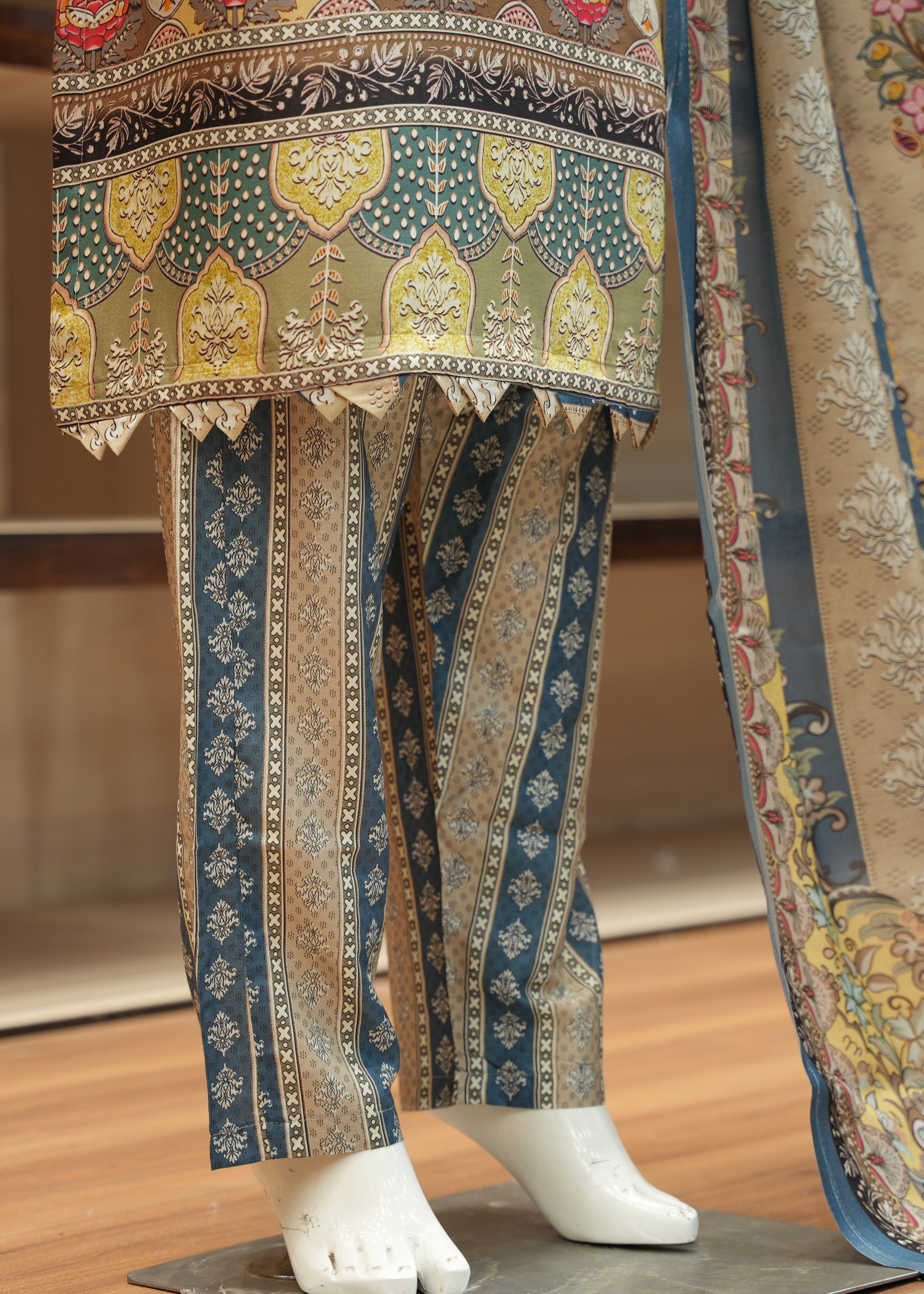 Traditional patterned fabric on a mannequin with a blurred background