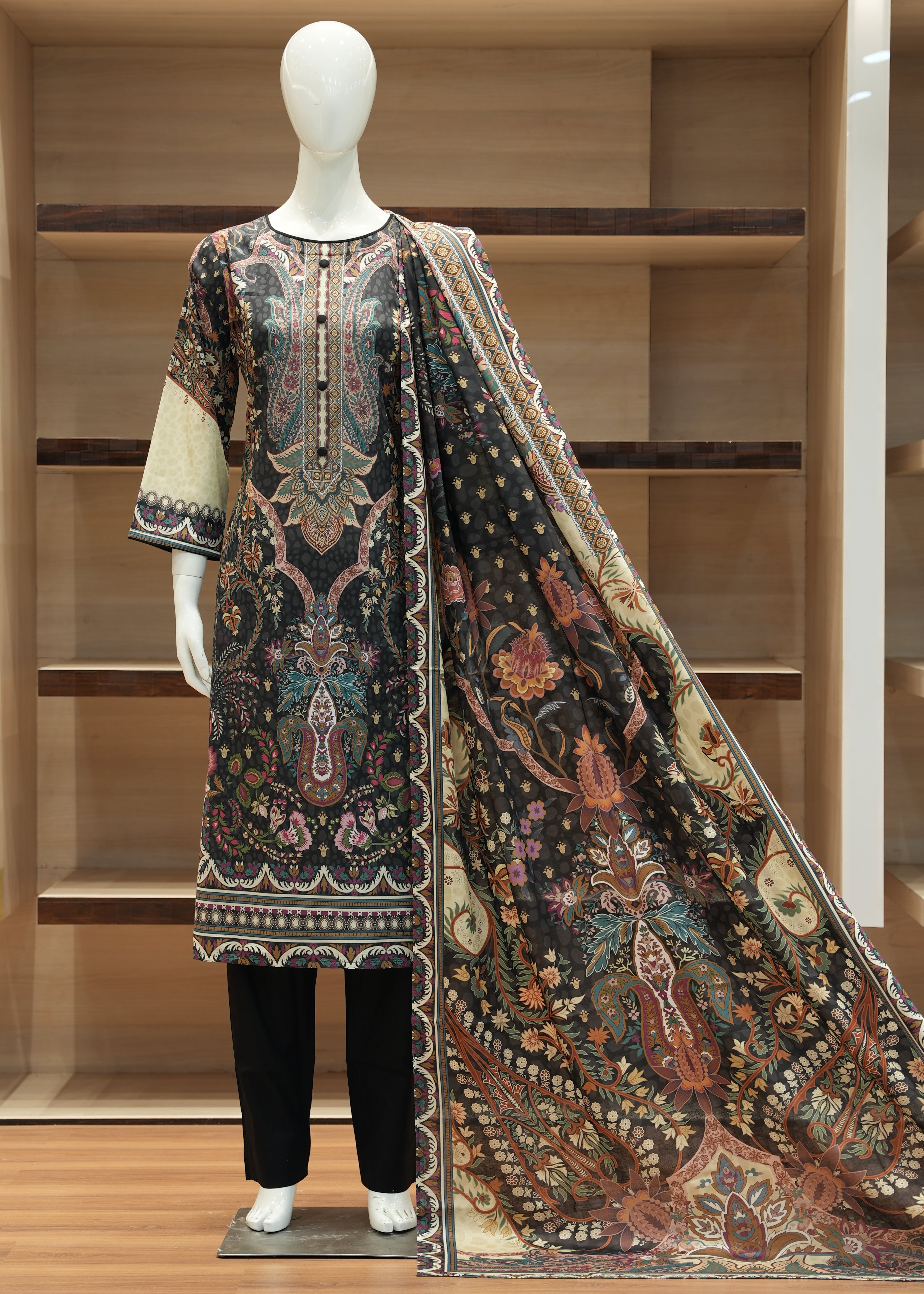 Decorative rug displayed on a mannequin against a wooden wall.