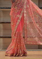 Red embroidered fabric draped over a wooden surface