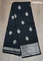 Black fabric with silver leaf patterns and a decorative border on a wooden surface, branded 'PREMJoy'.