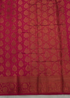 Red fabric with gold patterns on a light gray background