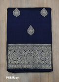 Navy blue fabric with silver embroidery on a wooden surface, branded 'PREMJoy'.