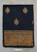 Black fabric with gold embroidery and 'PREMJoy' branding on a gray background